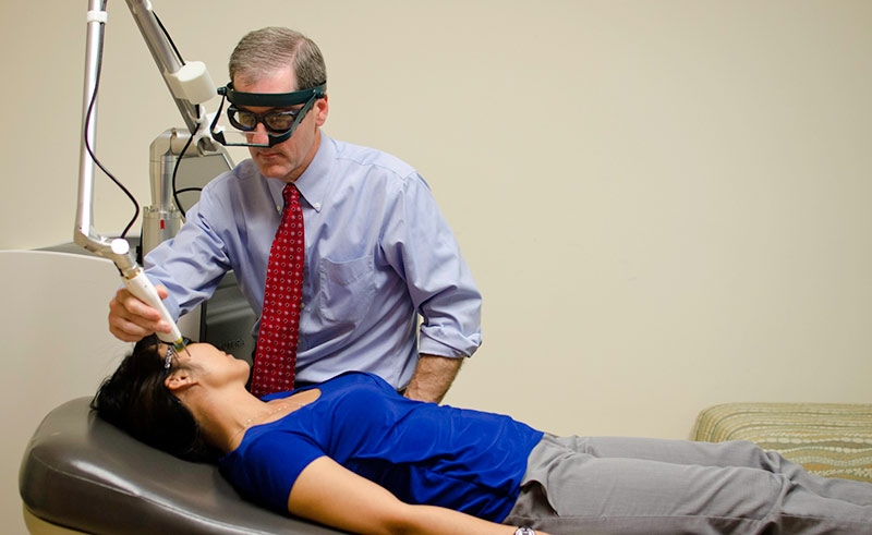 Dr. Green Giving a Laser Treatment