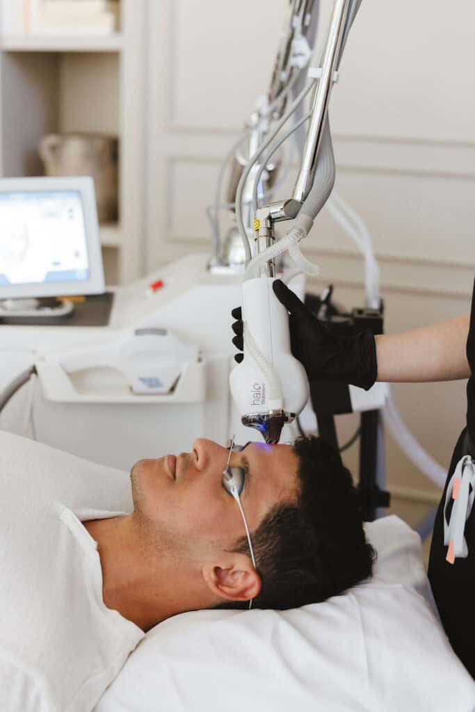 A patient receives a treatment from a Halo Tribird laser